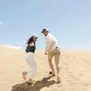 full-shot-couple-running-desert